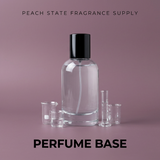 Perfume bottle with accessories on a pink background, featuring 'Peach State Fragrance Supply'.