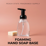 Foaming hand soap base with pump and bar of soap on a peach background, branded as Peach State Fragrance Supply.